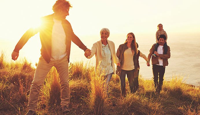 A family hiking showing an example of how MyHMB can help older adults